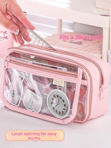 Pink multi-layer clear pencil case detail with 20cm ruler storage and wide opening