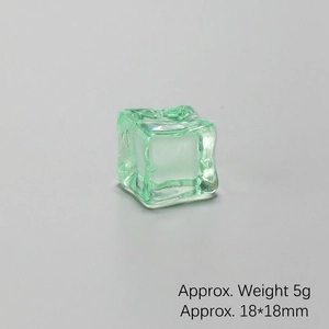 Macro detail of a green 18mm transparent acrylic ice cube for bar decor and photography