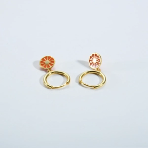 Close-up of S925 sterling silver gold earrings with orange fruit enamel pendant detail