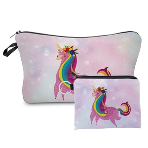 Detailed view of two pink cartoon cosmetic bags with unicorn and alpaca prints
