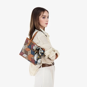 Elegant large color-block tote bag with geometric texture and silk scarf accessory