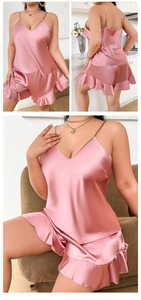 Detailed views of pink satin pajama set with ruffle hem shorts and camisole top