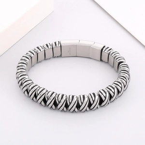 Close-up of twisted link steel bracelet with 316L stainless steel engraving on the clasp