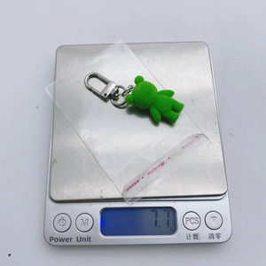 Detailed view showing the cute flocked frog keychain weighing approximately 7.7g