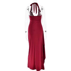 Detail view of red halter neck maxi dress with open back and high side slit