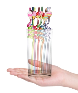 Detail of colorful twisted plastic straws with cartoon ice cream charms in a glass