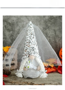 Detail of bride gnome with sequined hat, lace dress and white wedding veil decoration