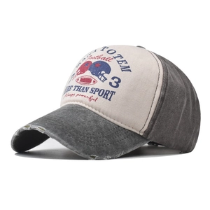 Close-up of vintage washed denim baseball cap with football themed print and embroidery