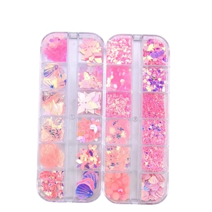 24-grid nail art sequins set featuring butterfly, heart, and star shapes in iridescent pink