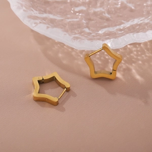 Elegant gold stainless steel star stud earrings on a textured pink fabric background