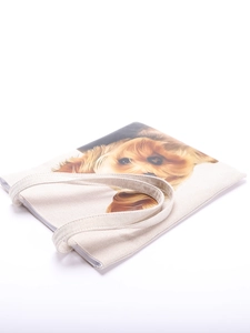 Close-up of canvas tote bag featuring a realistic Yorkshire Terrier print on cream fabric