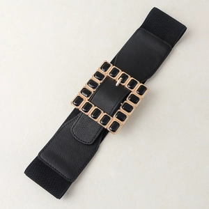 Detail of black elastic corset belt with gold square buckle and inset acrylic stones