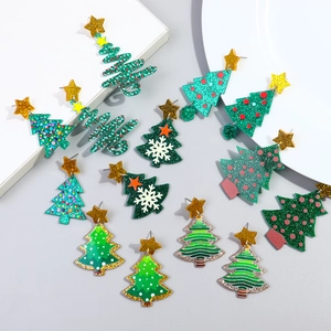 Festive Christmas tree acrylic star earrings set with green glitter and gold accents