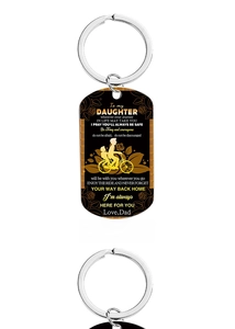 Close-up of military style stainless steel keychain with dad to daughter message