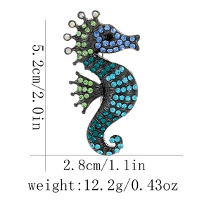 Detailed seahorse brooch with gradient blue and green rhinestones on dark grey alloy base