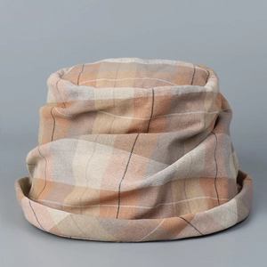 Close-up of vintage blue checkered bucket hat fabric showing natural cotton linen texture