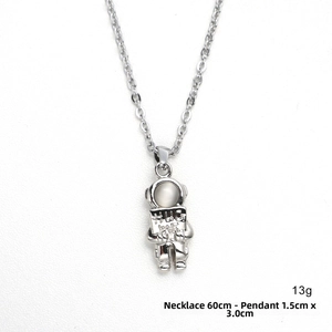 Detail of silver astronaut pendant with HUG ME engraving and opal-like helmet inlay