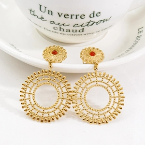 Bohemian gold titanium steel earrings featuring red natural stones in a sunburst design