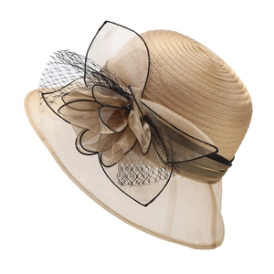 Elegant champagne organza sun hat with oversized floral mesh decoration for summer beach