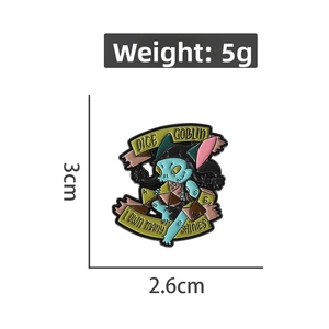 Detail showing Dice Goblin enamel pin with I Own Many Shinies text and 3cm height specs