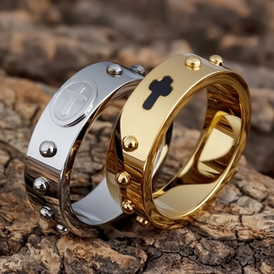 8mm stainless steel rosary cross rings in gold and silver finish on wood background