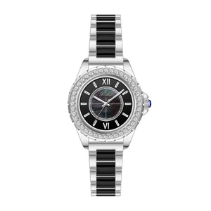 Macro view of crystal-encrusted bezel and silver-black ceramic link strap on a watch