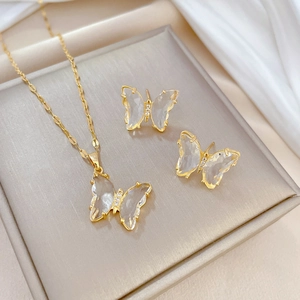 Golden butterfly jewelry set with crystal wings and necklace in a premium display box
