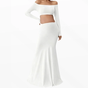 Detail of white off-shoulder maternity two-piece set with long sleeves and fishtail skirt