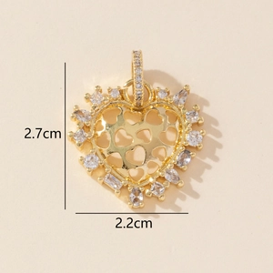Detail of gold heart pendant with zircon inlay showing dimensions 2.7cm by 2.2cm