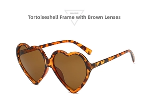 Detailed view of heart-shaped tortoiseshell sunglasses frame with metal hinges