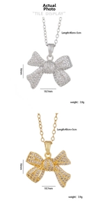 Detailed size specifications for gold and silver bow pendants with cubic zirconia inlay