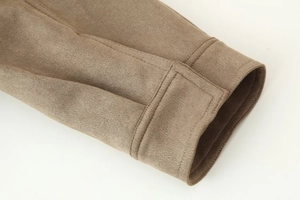 Detailed macro view of brown suede jacket cuff with reinforced double stitching detail