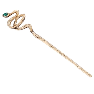 Golden snake hair pin with green gemstone eyes and metallic scale texture on white background