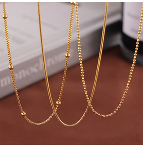 Detailed view of three gold-plated titanium steel chains: box, snake, and bead styles