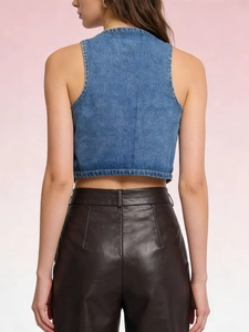 Rear view of a slim-fit blue denim vest paired with brown leather pants for a retro look