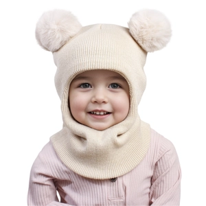 Detail of baby beige knit hat featuring double pom-poms and integrated neck warmer