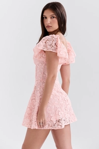 Detailed side view of pink lace mini dress featuring elegant ruffled butterfly sleeves