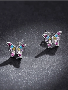 Macro shot of S925 sterling silver butterfly earrings with colorful pavé gemstones