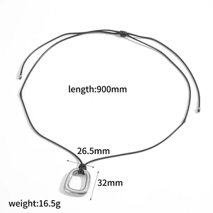 Macro view of stainless steel heart pendant with detailed dimensions and cord length