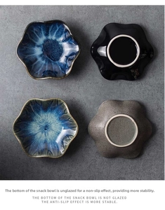 Detail view of wave-edged ceramic dipping bowls showing non-slip unglazed bottoms
