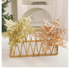 Close-up of sparkling gold artificial Christmas flowers with sequins and festive glitter