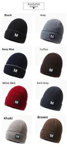 Grid display of knitted beanie hats in eight colors with M letter patch and rib texture