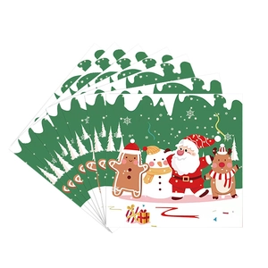 Christmas party paper napkins with Santa, snowman, and reindeer motifs for holiday table decor