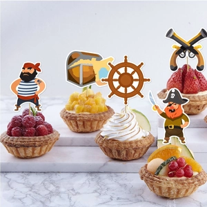Pirate theme cupcake toppers with captain and treasure chest on fruit tarts