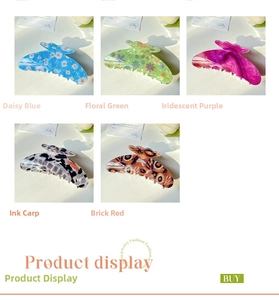 Detail of five floral hair claws in blue daisy, green marble and glossy acetate patterns
