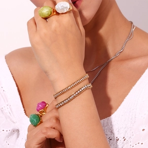 Three-layer 18K gold plated beaded bracelet with cubic zirconia on woman's wrist