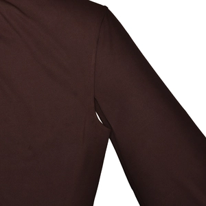 Detail of dark brown dress showing high-quality stitching and smooth fabric texture