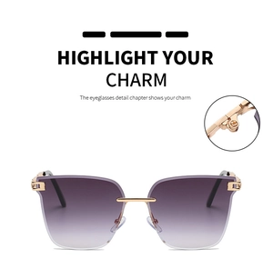 Detail of rimless gradient purple sunglasses with gold metal hinges and screws