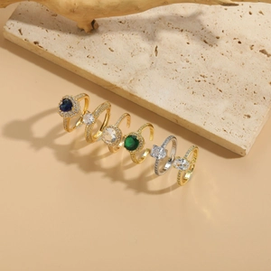 Detailed view of luxury wedding rings with colorful zircon stones in gold and silver plating