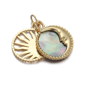 Detail of gold-plated sun and moon face pendant with iridescent rainbow shell inlay
